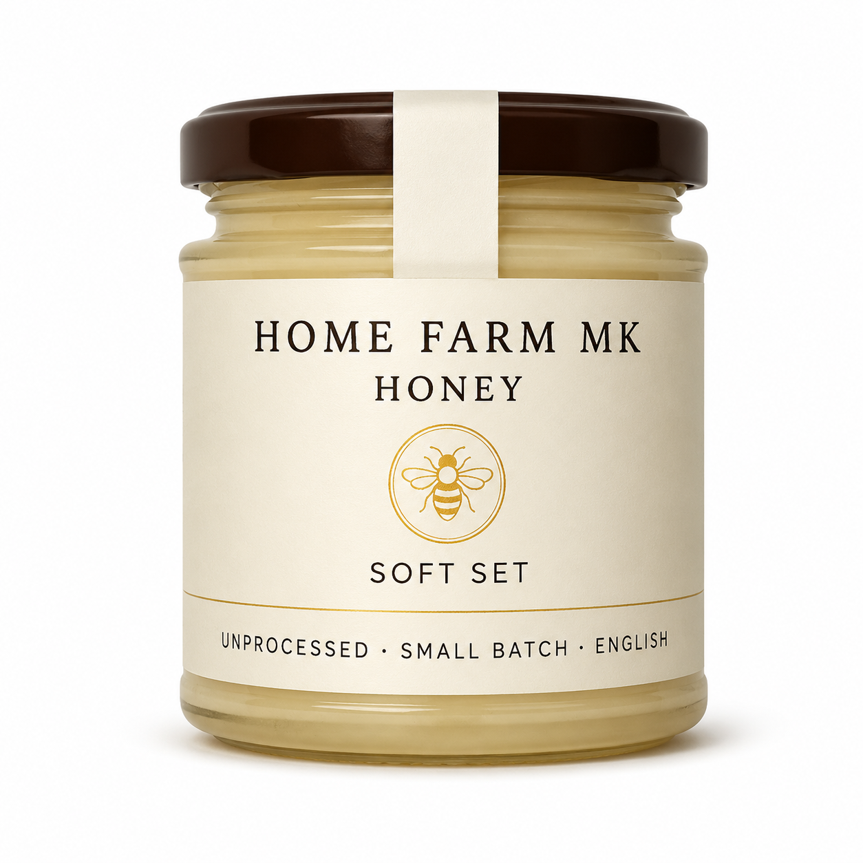A jar of Home Farm Mk Honey Soft Set, featuring a cream-colored label with a gold bee logo and a dark brown lid, set against a plain white background.