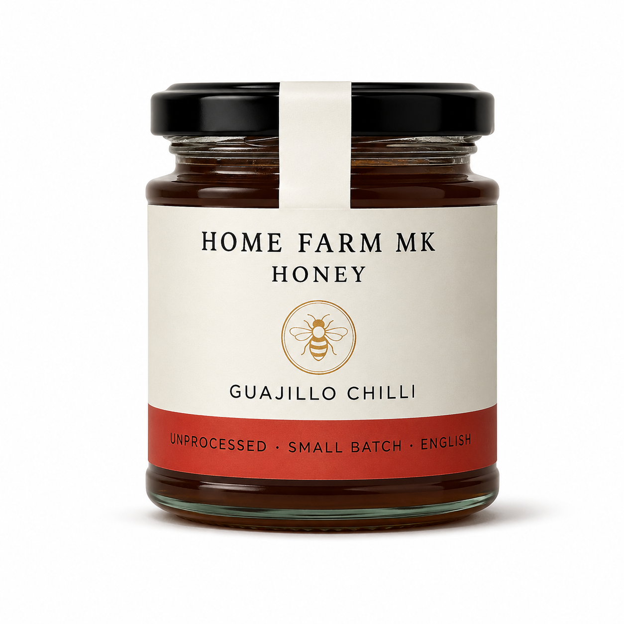 A glass jar of Home Farm Mk Guajillo Chilli Honey with a black lid, cream label, and red bottom band, shown on a white background.