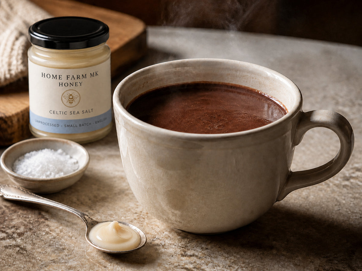 Hot chocolate with soft-set Celtic Sea Salt Honey and a small bowl of sea salt.