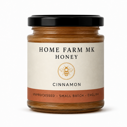 Home Farm MK Cinnamon English Honey jar without a tamper band, on a clean white background.
