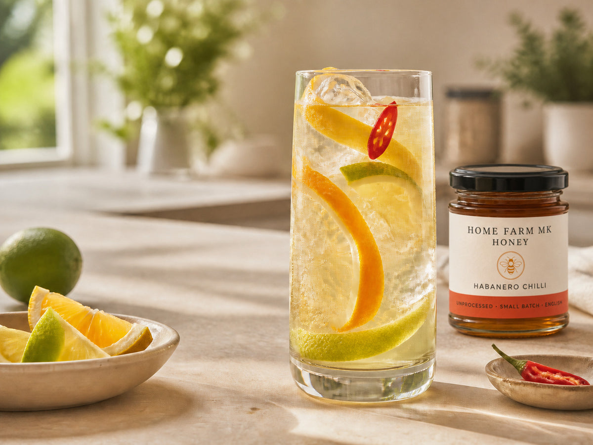 A sparkling citrus drink beside Habanero Chilli Honey.